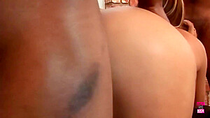 A Pretty Brunette In Stockings And High Heels Gets Double Penetrated By Two Black Guys