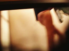 A bodibuilder woman is not aware that a hidden dressing room camera is spying after her