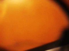 A bodibuilder woman is not aware that a hidden dressing room camera is spying after her