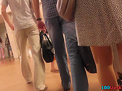 Amateur brunette shows off lingerie in candid upskirts