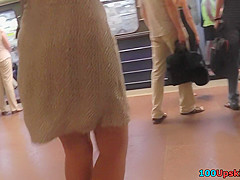 Amateur brunette shows off lingerie in candid upskirts