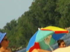 Amateur milfs on a hidden nudist beach cam