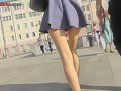 Amateur redhead shows sexy legs in candid upskirts