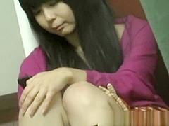 Asian ho rubs hairy pussy