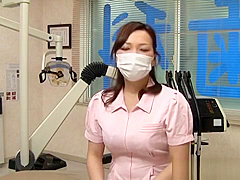 Asian nurse with big tits hides behind a mask