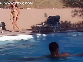 Babe Provides Satisfaction To Two Men By The Pool