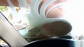 Beautiful girls wash an expensive car