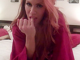 Bedtime striptease with a redhead