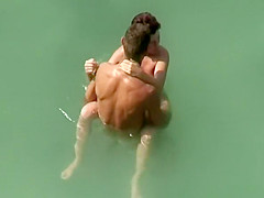 Big dick nude man fucks naked woman in water