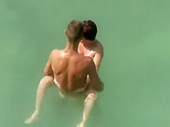 Big dick nude man fucks naked woman in water