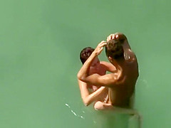 Big dick nude man fucks naked woman in water