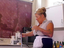 Big titted woman is doing some nasty stuff in the kitchen, while no one is watching