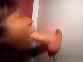 Black Amateur On Her Knees Sucking Dick Through Glory Hole