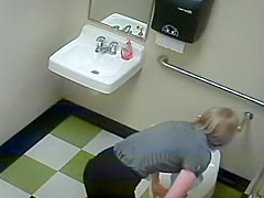 Blonde girl in pees in a public toilet