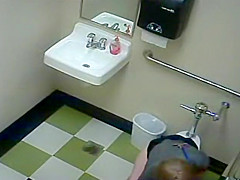 Blonde girl in pees in a public toilet