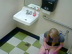 Blonde girl in pees in a public toilet