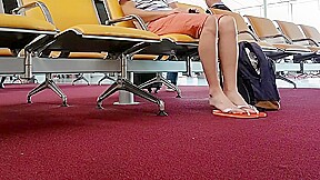 Boy put on flip flops and anklet in airport