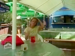 Busty blonde posing when fingering the pussy in public
