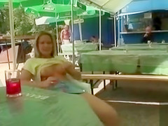 Busty blonde posing when fingering the pussy in public