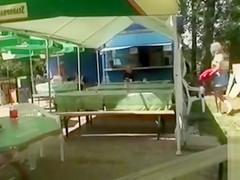 Busty blonde posing when fingering the pussy in public