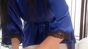 Busty brunette sucking cock