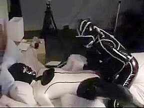 Cute college girl making out in latex catsuits