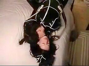 Cute college girl making out in latex catsuits