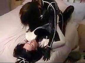Cute college girl making out in latex catsuits