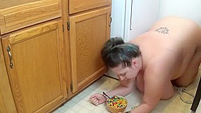 Fattened wife in kitchen