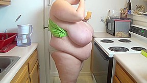 Fattened wife in kitchen