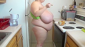 Fattened wife in kitchen