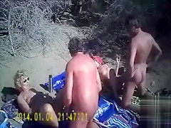 French swingers fuck on the nude beach as people watch