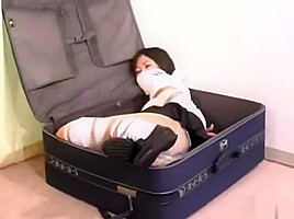 Girl Bound and Gagged in Suitcase