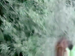 Girl in bikini and shorts peeing
