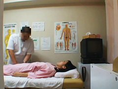 Girl lying on back letting man look inside pussy on