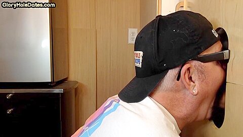 Gloryhole homemade DILF sucks and wanks BFs cock at home