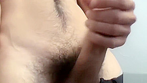 Hairy jock stroking his massive cock until he cums hard