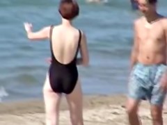 Hot housewife is wearing black candid swimsuit on beach 07y