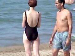 Hot housewife is wearing black candid swimsuit on beach 07y