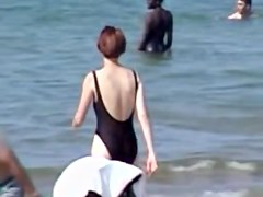 Hot housewife is wearing black candid swimsuit on beach 07y