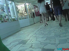 Hot upskirt g-string footage of brunette's flabby ass