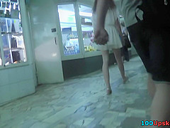 Hot upskirt g-string footage of brunette's flabby ass