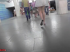 Hot upskirt g-string footage of brunette's flabby ass