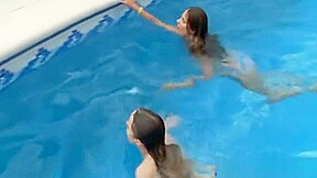Lesbian lovers make love by the pool