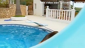 Lesbian lovers make love by the pool