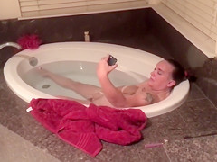 Mature woman facetimes when fingering her clit in the tub