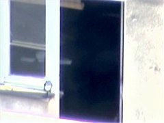 Nude titted minx caught on cam on the balcony