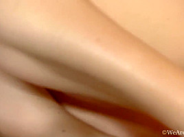 Olga wanks her hairy pussy in bed