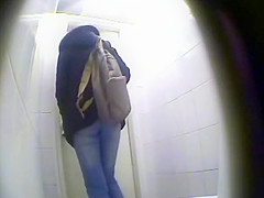 Peeping pissing women in the public toilet