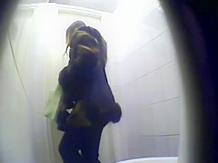Peeping pissing women in the public toilet